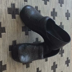 Dansko black tooled leather closed-back clogs